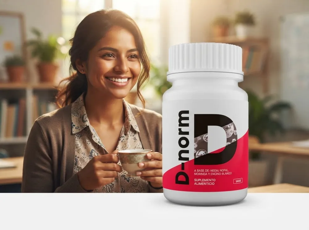 Mujer joven tomando una infusión en su lugar de trabajo con el envase de D-Norm